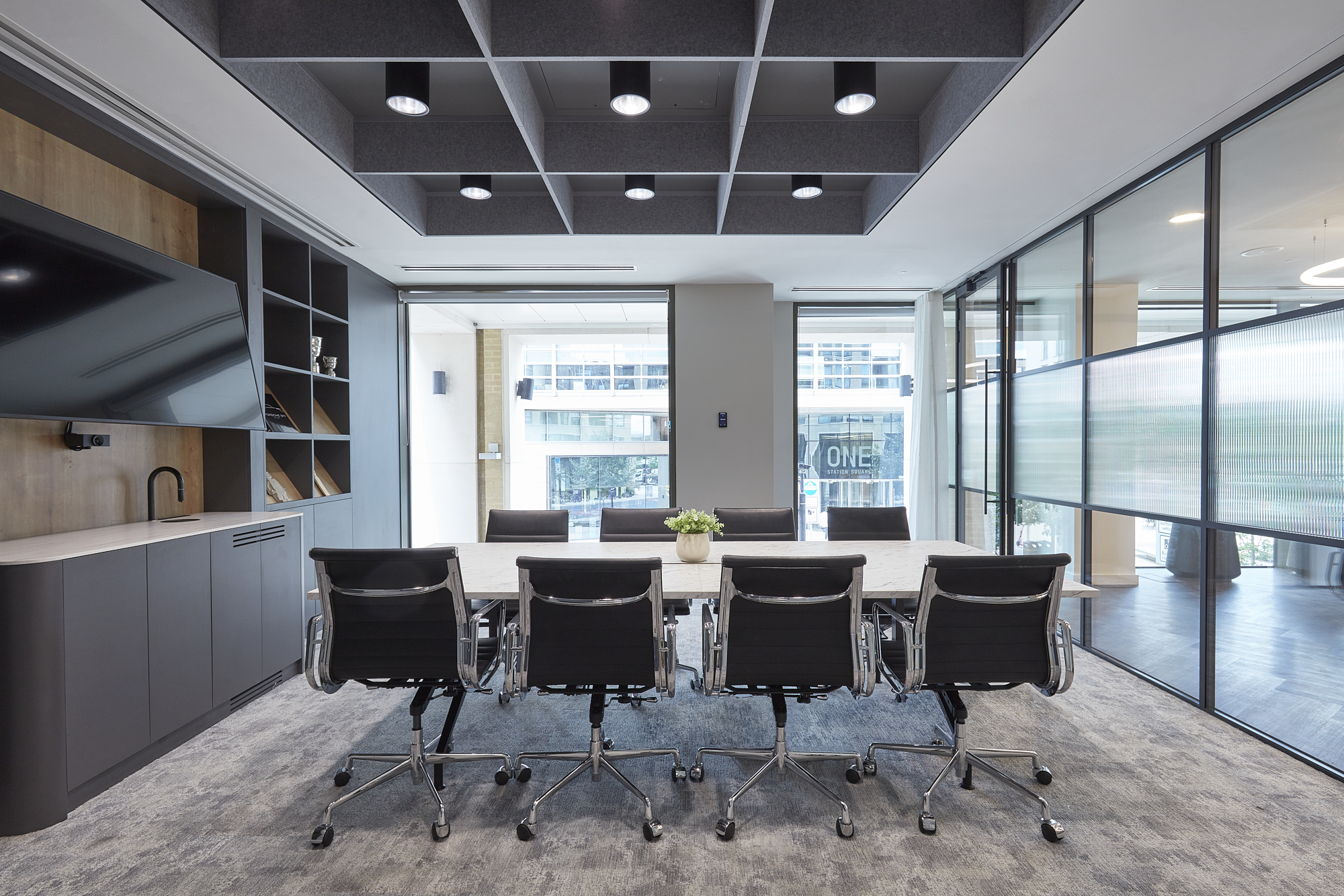 meeting room with large windows and marble table
